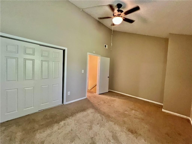 11914 E 59th Ter, Kansas City, MO 64133 - unfurnished bedroom with carpet floors, baseboards, high vaulted ceiling, a ceiling fan, and a closet
