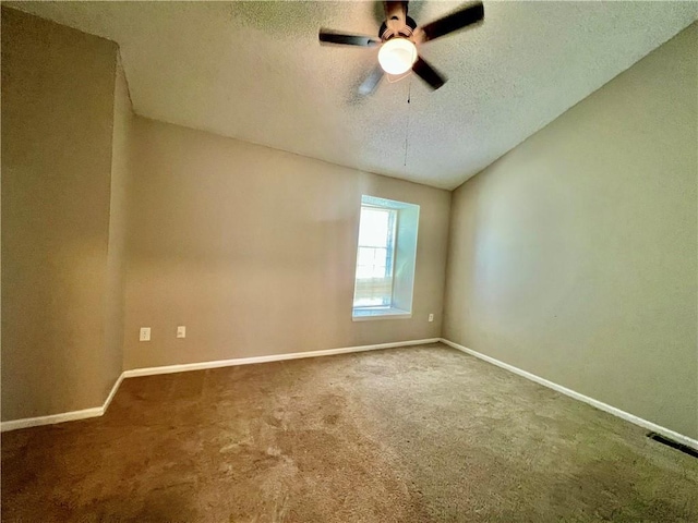11914 E 59th Ter, Kansas City, MO 64133 - carpeted spare room featuring a textured ceiling, baseboards, and a ceiling fan