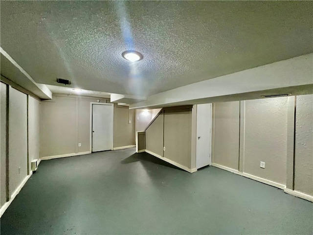 11914 E 59th Ter, Kansas City, MO 64133 - finished basement featuring a textured ceiling and baseboards