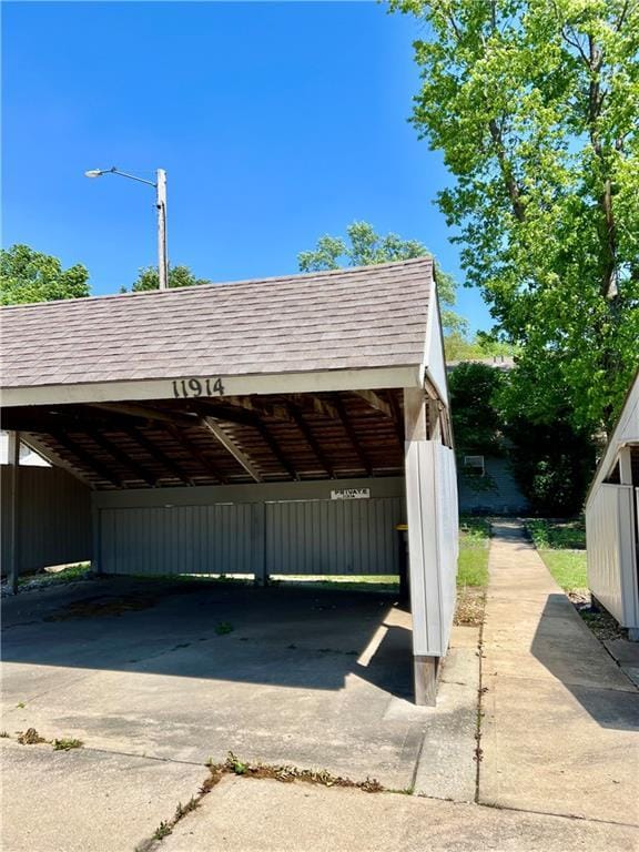 11914 E 59th Ter, Kansas City, MO 64133 - view of car parking with a carport