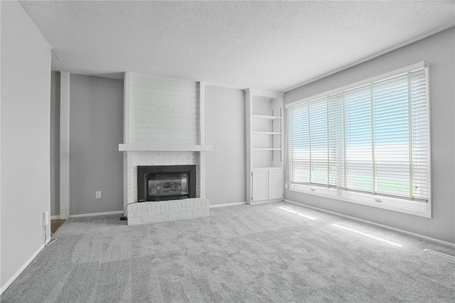 10981 Rosehill Rd, Overland Park, KS 66210 - unfurnished living room featuring a textured ceiling, a fireplace, carpet floors, and baseboards