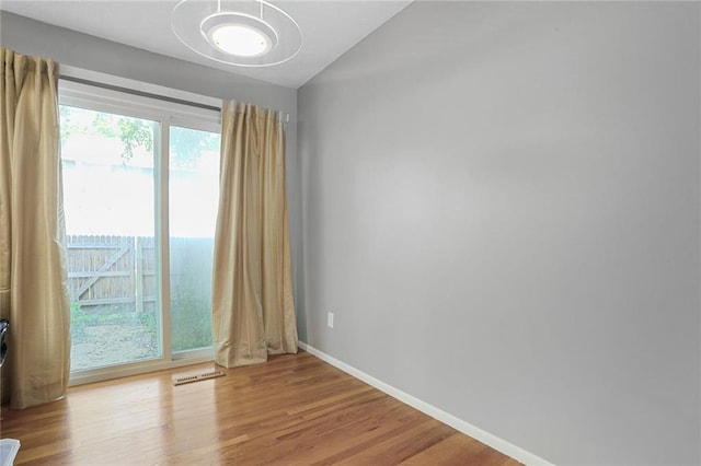 10981 Rosehill Rd, Overland Park, KS 66210 - empty room featuring baseboards and wood finished floors