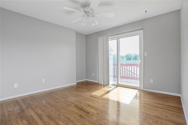 10981 Rosehill Rd, Overland Park, KS 66210 - unfurnished room featuring baseboards, wood finished floors, and ceiling fan