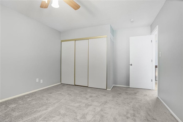 10981 Rosehill Rd, Overland Park, KS 66210 - unfurnished bedroom with carpet flooring, a closet, baseboards, ceiling fan, and a textured ceiling