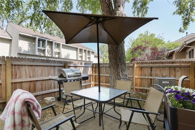 10981 Rosehill Rd, Overland Park, KS 66210 - view of patio / terrace with a fenced backyard, outdoor dining space, grilling area, and central AC unit