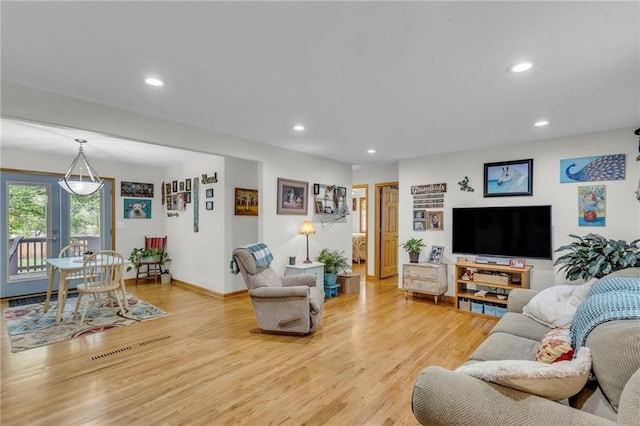 203 Pine St, Wellsville, KS 66092 - living area with recessed lighting, light wood-style flooring, and baseboards