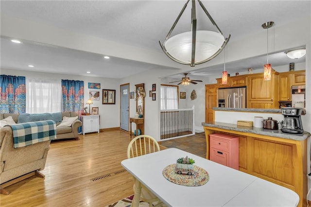 203 Pine St, Wellsville, KS 66092 - dining room featuring a ceiling fan, recessed lighting, baseboards, and light wood-style flooring