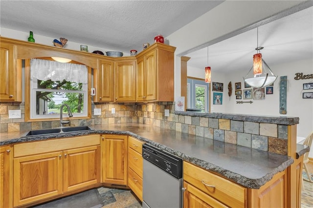 203 Pine St, Wellsville, KS 66092 - kitchen with dishwasher, a sink, a peninsula, dark countertops, and a textured ceiling
