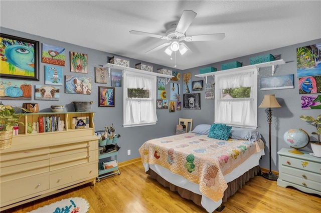 203 Pine St, Wellsville, KS 66092 - bedroom with multiple windows, wood finished floors, and baseboards