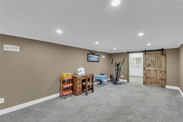 203 Pine St, Wellsville, KS 66092 - workout area featuring a barn door, carpet floors, baseboards, and recessed lighting