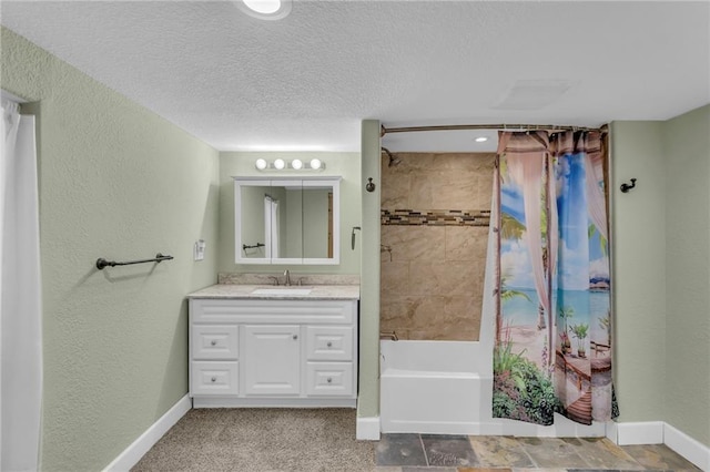 203 Pine St, Wellsville, KS 66092 - full bath with shower / bath combo with shower curtain, baseboards, vanity, a textured wall, and a textured ceiling