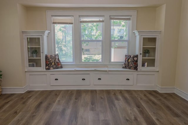 unfurnished room featuring wood finished floors and baseboards