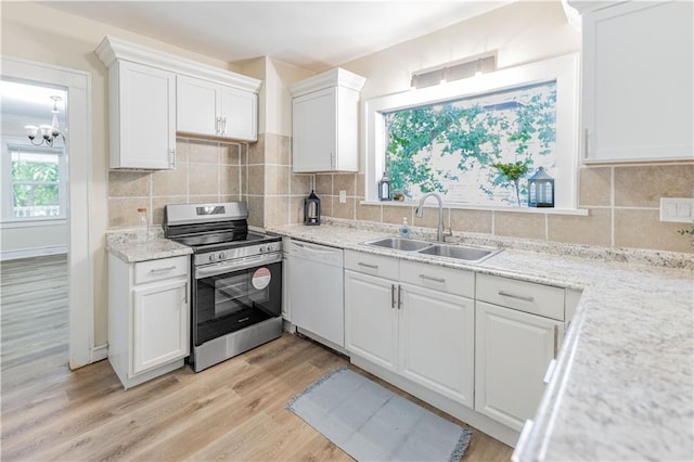 1515 E 77th Ter, Kansas City, MO 64131 - kitchen featuring stainless steel electric stove, dishwasher, white cabinetry, light wood-style flooring, and a chandelier