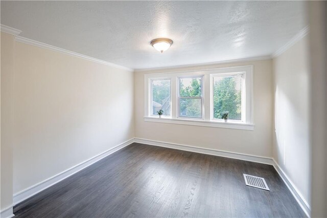 1515 E 77th Ter, Kansas City, MO 64131 - spare room featuring dark wood-style floors, crown molding, and a textured ceiling