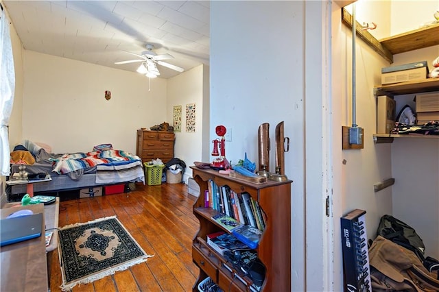 bedroom featuring hardwood / wood-style flooring and a ceiling fan