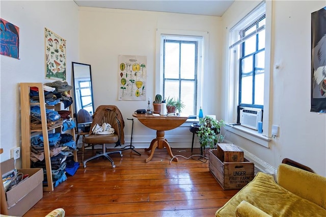 office with hardwood / wood-style flooring, baseboards, and cooling unit