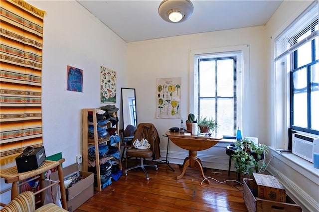 office area with dark wood-type flooring and baseboards