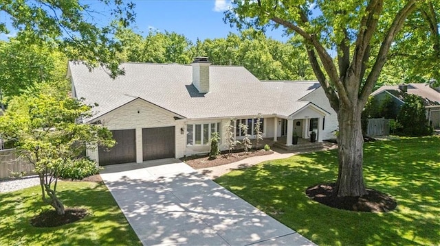 view of front of house featuring a garage, driveway, a chimney, and stone siding