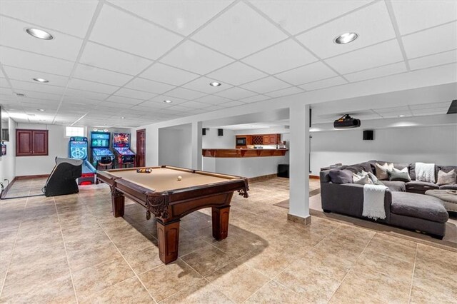 game room with a paneled ceiling, pool table, baseboards, recessed lighting, and light tile patterned flooring