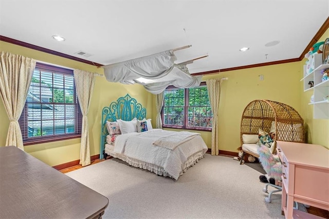 carpeted bedroom featuring crown molding, baseboards, and recessed lighting