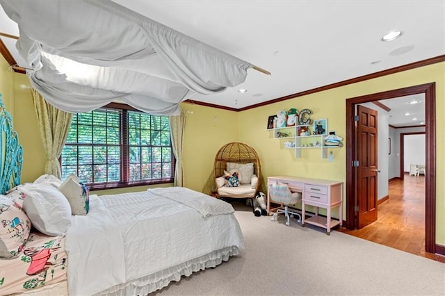 bedroom featuring crown molding, recessed lighting, and carpet