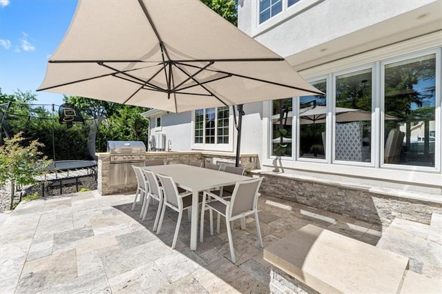 view of patio featuring outdoor dining space and area for grilling