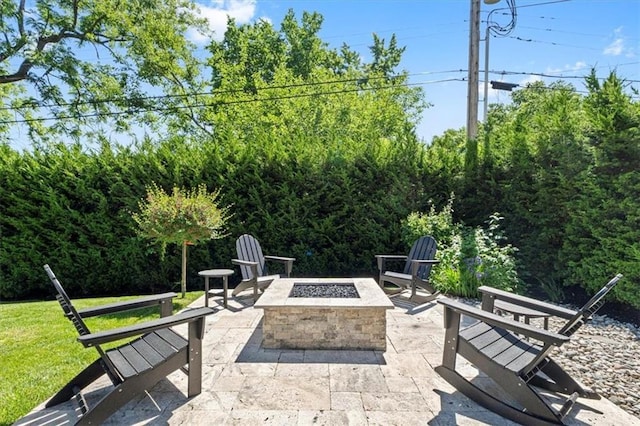 view of patio with a fire pit
