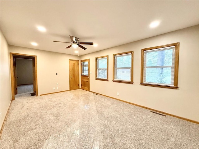 unfurnished bedroom with baseboards, light colored carpet, recessed lighting, and a ceiling fan