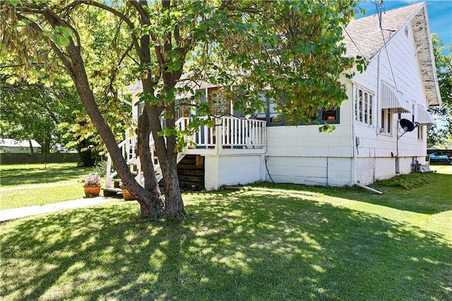 827 Pacific Ave, Osawatomie, KS 66064 - view of property exterior featuring a shingled roof