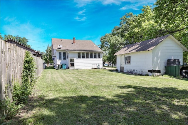 827 Pacific Ave, Osawatomie, KS 66064 - back of property featuring a chimney and a shingled roof