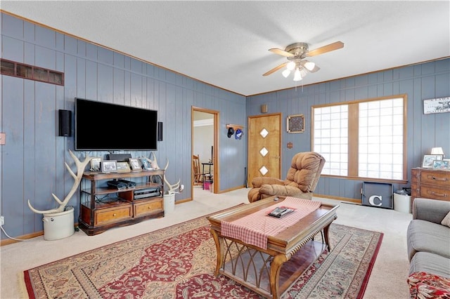 827 Pacific Ave, Osawatomie, KS 66064 - carpeted living area featuring ceiling fan and a textured ceiling