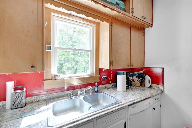 827 Pacific Ave, Osawatomie, KS 66064 - kitchen with dishwasher, a sink, and light countertops
