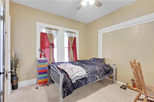 827 Pacific Ave, Osawatomie, KS 66064 - carpeted bedroom with baseboards and ceiling fan