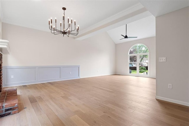 1051 E 121st St, Olathe, KS 66061 - empty room with light wood finished floors, a chandelier, a ceiling fan, lofted ceiling, and ornamental molding