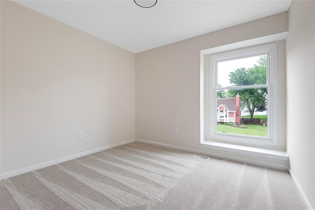 1051 E 121st St, Olathe, KS 66061 - spare room featuring light colored carpet and baseboards