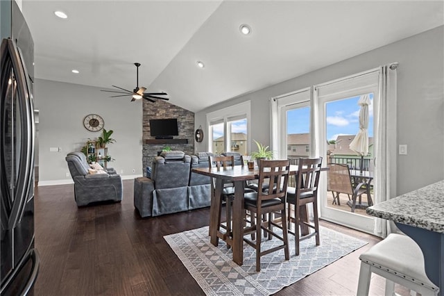 16025 Craig St, Basehor, KS 66007 - dining space featuring a ceiling fan, dark wood-style floors, a fireplace, vaulted ceiling, and recessed lighting
