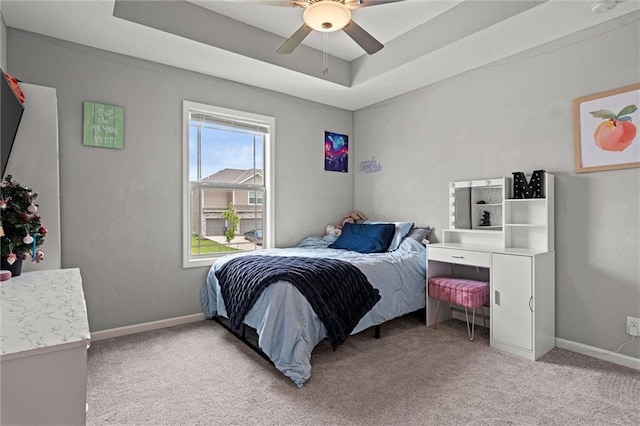 16025 Craig St, Basehor, KS 66007 - bedroom with light colored carpet, a raised ceiling, baseboards, and a ceiling fan