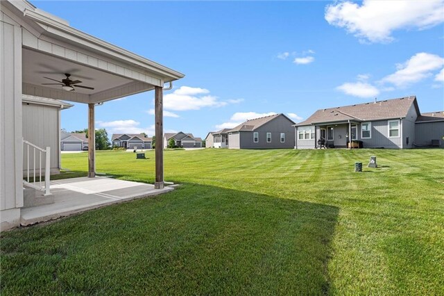 1532 SW Arbor Valley Dr, Lees Summit, MO 64082 - view of green lawn featuring a residential view, a ceiling fan, and a patio area