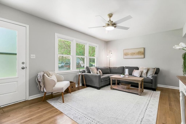 9811 Cambridge Ave, Kansas City, MO 64134 - living room featuring wood finished floors, a ceiling fan, and baseboards
