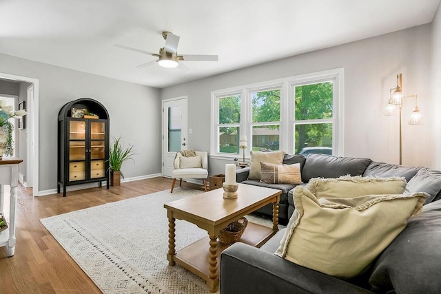 9811 Cambridge Ave, Kansas City, MO 64134 - living area with wood finished floors, ceiling fan, and baseboards