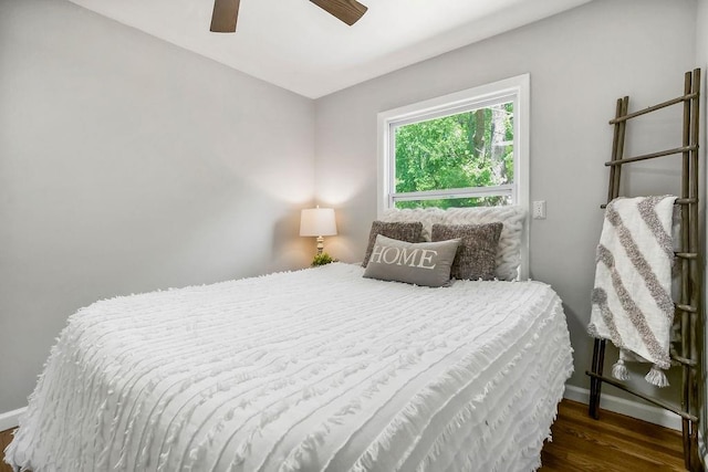 9811 Cambridge Ave, Kansas City, MO 64134 - bedroom featuring wood finished floors, baseboards, and ceiling fan