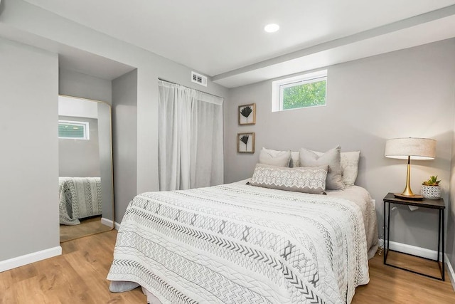 9811 Cambridge Ave, Kansas City, MO 64134 - bedroom featuring baseboards, wood finished floors, and recessed lighting