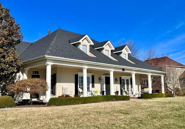 4704 SW Gull Point Dr, Lees Summit, MO 64082 - view of front of property with french doors, a front yard, stucco siding, covered porch, and roof with shingles
