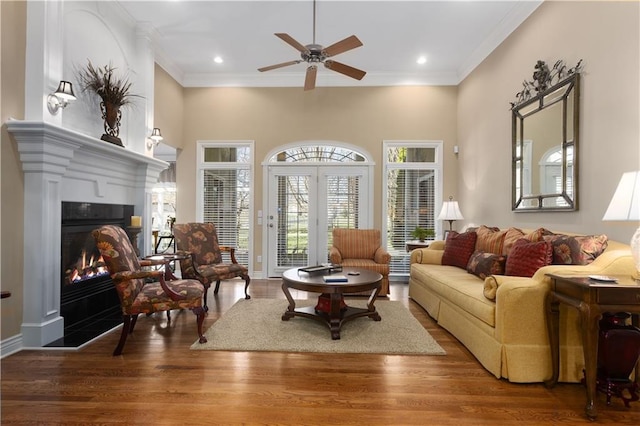 4704 SW Gull Point Dr, Lees Summit, MO 64082 - living area with ceiling fan, a warm lit fireplace, ornamental molding, wood finished floors, and recessed lighting