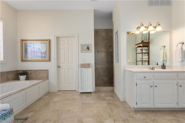 4704 SW Gull Point Dr, Lees Summit, MO 64082 - bathroom with vanity, a bath, tiled shower, and baseboards