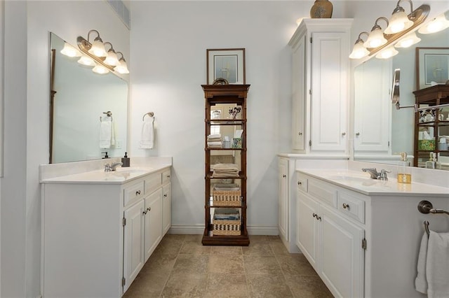 4704 SW Gull Point Dr, Lees Summit, MO 64082 - bathroom with two vanities and baseboards