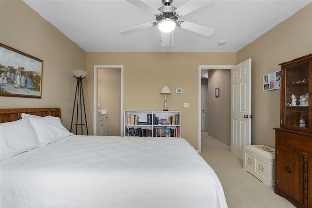 4704 SW Gull Point Dr, Lees Summit, MO 64082 - bedroom featuring light colored carpet, a ceiling fan, and ensuite bathroom