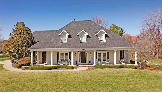 4704 SW Gull Point Dr, Lees Summit, MO 64082 - cape cod house featuring french doors, a front yard, covered porch, and roof with shingles