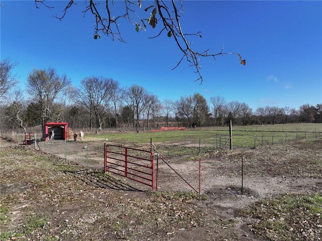 6721 S Read Rd Unit 1, Pleasanton, KS 66075 - view of yard featuring a rural view and fence