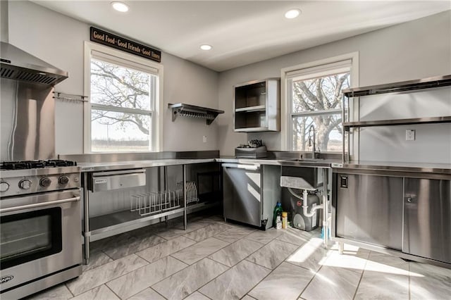 6721 S Read Rd Unit 1, Pleasanton, KS 66075 - kitchen featuring stainless steel countertops, stainless steel stove, healthy amount of natural light, recessed lighting, and wall chimney exhaust hood